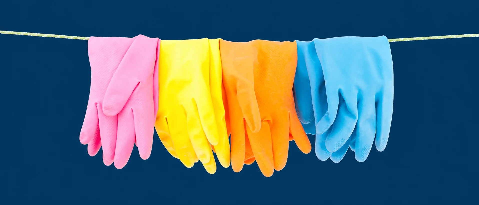 Colourful cleaning cloths on an Entretien Maestro blue background